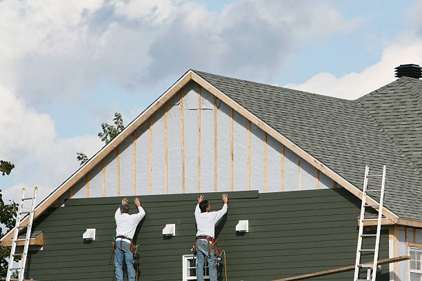 Professional Siding technician working in Davidson, NC